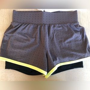 Fabletics gray shorts with yellow trim